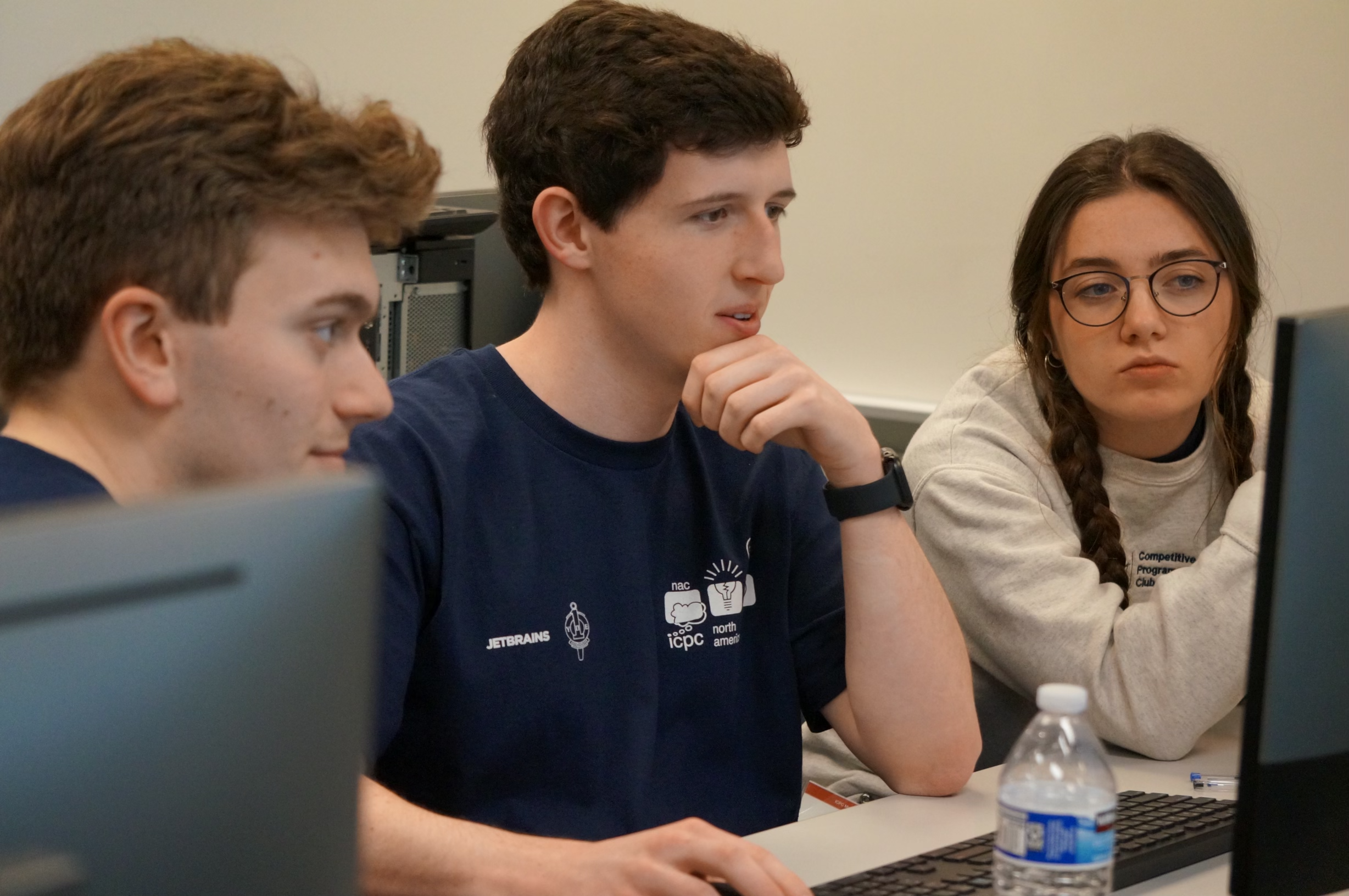 Will looking intently at a computer.